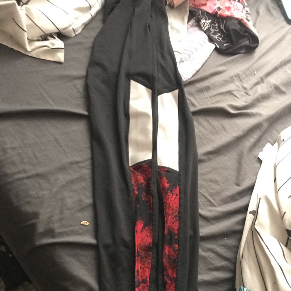 black leggings with reflextor panels and red mesh